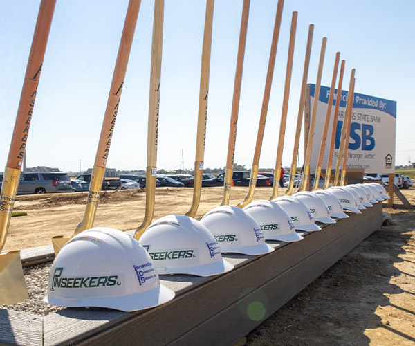 SBA small business loans in Iowa groundbreaking with hard hats and shovels