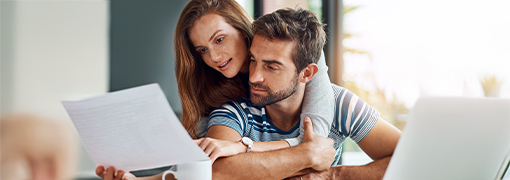 Couple looking at different options for consolidation their debt into one monthly payment.