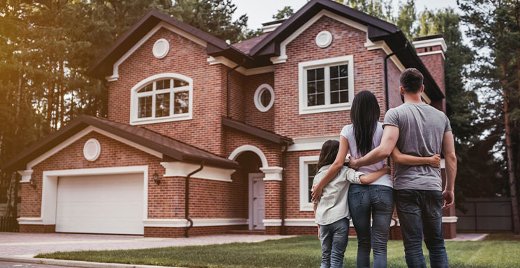 Young family showcasing the benefits of owning a home in Iowa.