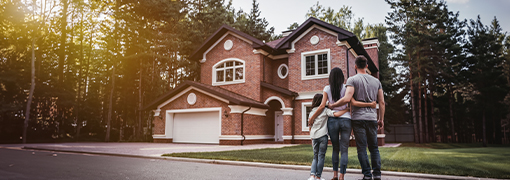 Young family showcasing the benefits of owning a home in Iowa.