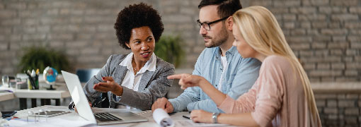 Business professionals working together on a laptop