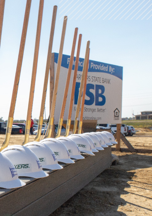 FSB supports Eastern Iowa business growth at groundbreaking ceremony with hard hats and shovels.