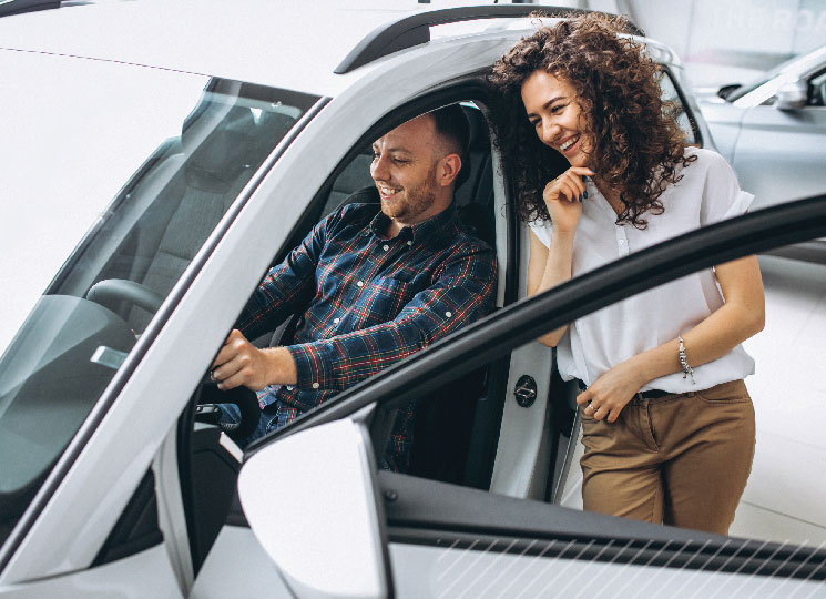 Couple shopping for a new car after getting a preapproval for an auto loan with FSB in Eastern Iowa