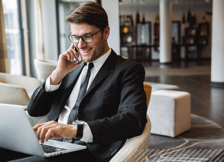 Businessman sending a wire transfer with FSB on his computer