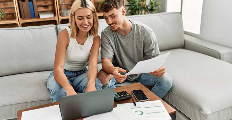 Young couple exploring FHA loans for a home purchase in Cedar Rapids, IA.