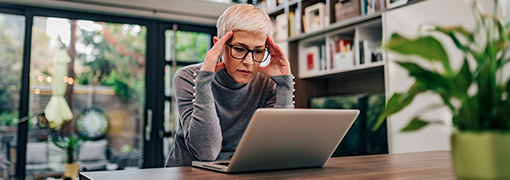 Customer reading up on computer tips to protect her accounts.