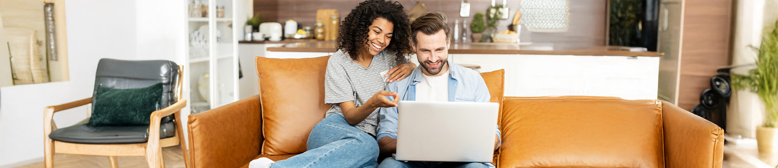 Young couple looking at FSB's financial resources to help plan for the future.