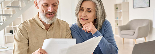 Couple reviewing their 401k accounts and wondering what they should do with all of them.