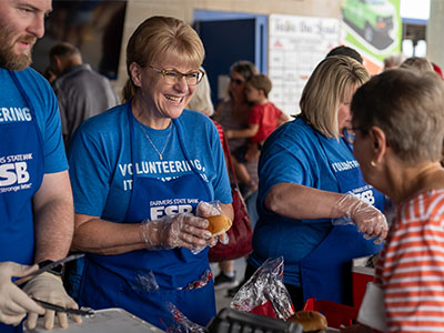 FSB employee serving customers at the annual customer picnic