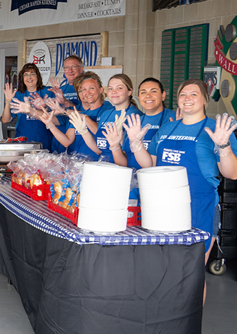 FSB at a community event handing out food