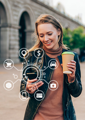 A woman using FSB's Mobile Banking on her phone with digital banking icons around her.